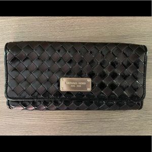 Michael Kors woven black clutch